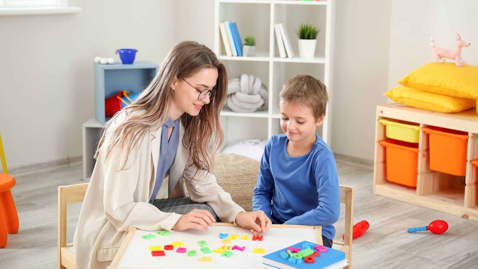 Child engaging in a therapy session with a therapist
