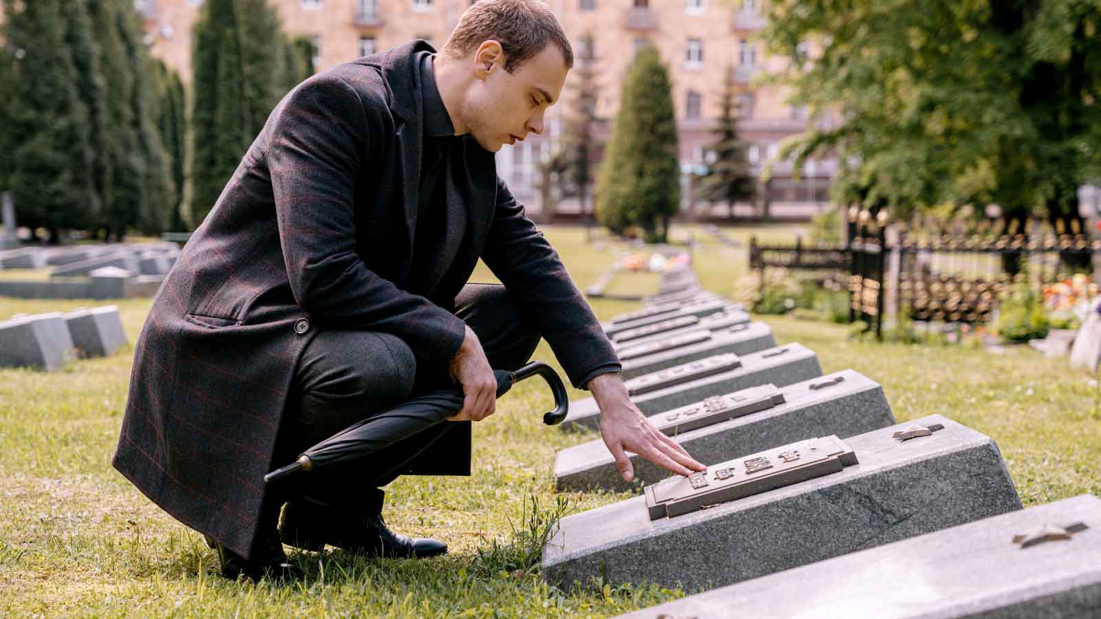 A-person-paying-respects-at-a-cemetery-(1)